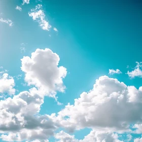 Fluffy Clouds in Azure Sky
