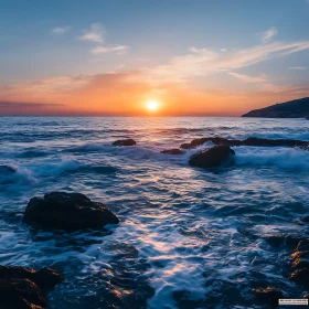 Ocean Sunset with Rocks and Waves