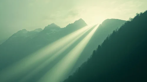 Sun Rays Piercing Through Mountain Peaks at Dawn