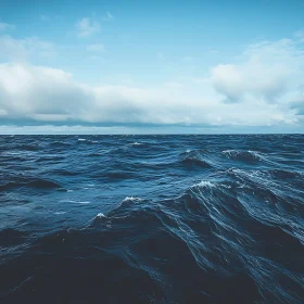 Calm Ocean Under Cloudy Sky