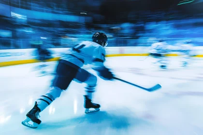 Hockey Player in Action on Ice Rink Captured in Motion