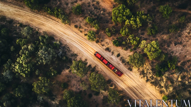 Aerial Shot of a Red Truck Driving Through Forested Landscape AI Image