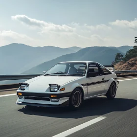 Retro White Car on Scenic Mountain Drive