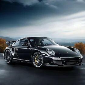 Luxury Black Sports Car with Scenic Backdrop