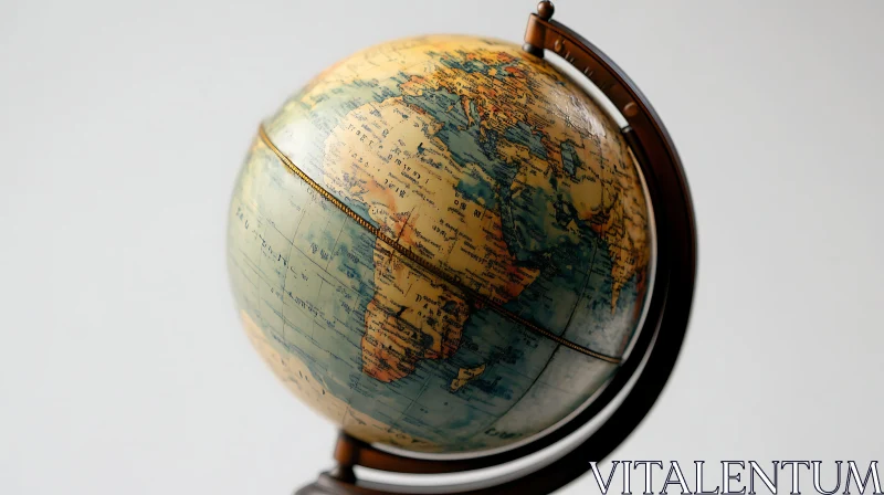 Vintage Globe Featuring Intricate Map and Bronze Base AI Image