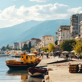 Serene Waterfront City and Mountain Landscape