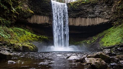 Cascading Waterfall Amidst Lush Greenery