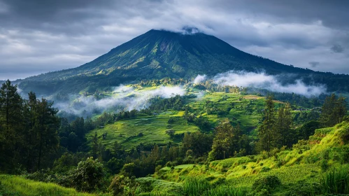 Majestic Green Mountain with Whimsical Clouds