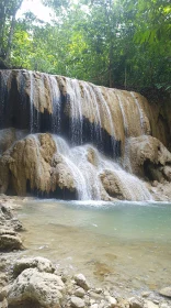 Tranquil Waterfall Amidst Greenery