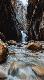 Peaceful Waterfall Flowing Through Canyon