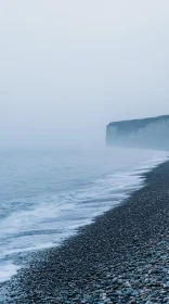 Ethereal Coastal Landscape with Pebbles and Cliff