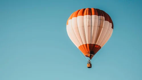 Red and White Hot Air Balloon in Flight