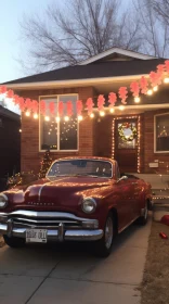 Red Vintage Car Parked by House | Festive Atmosphere