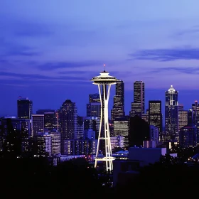 City Skyline at Night with Glowing Tower