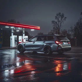 Sleek Vehicle at Night Gas Pump