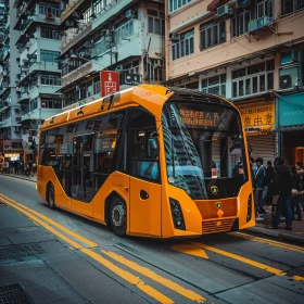 Contemporary Orange Bus in Busy Cityscape