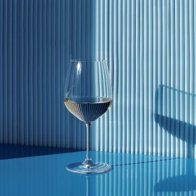 Wine Glass with Shadows on Blue Background