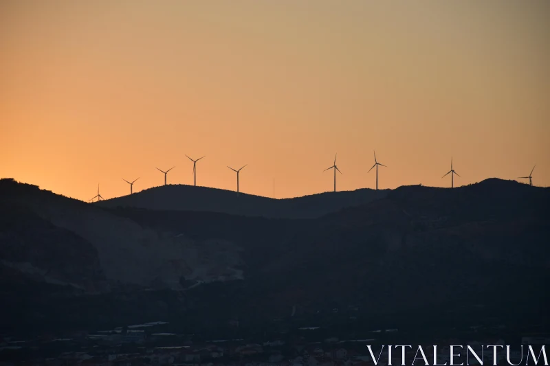 Silhouetted Windmills at Sunset Free Stock Photo