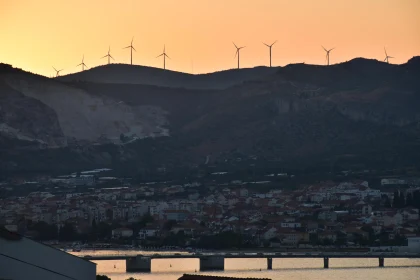 Coastal Sunset with Wind Turbines