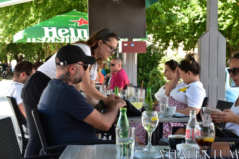 PHOTO Social Gathering at an Outdoor Cafe