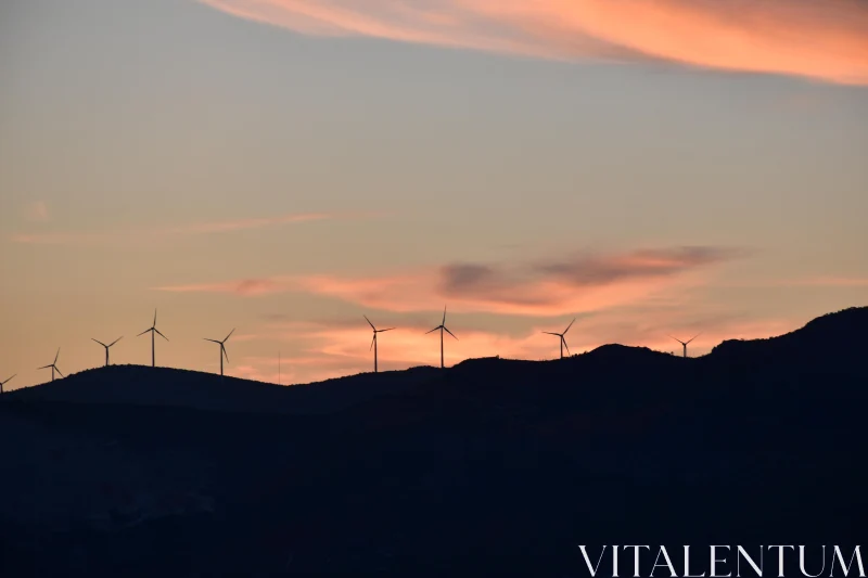 Silhouetted Windmills at Sunset Free Stock Photo