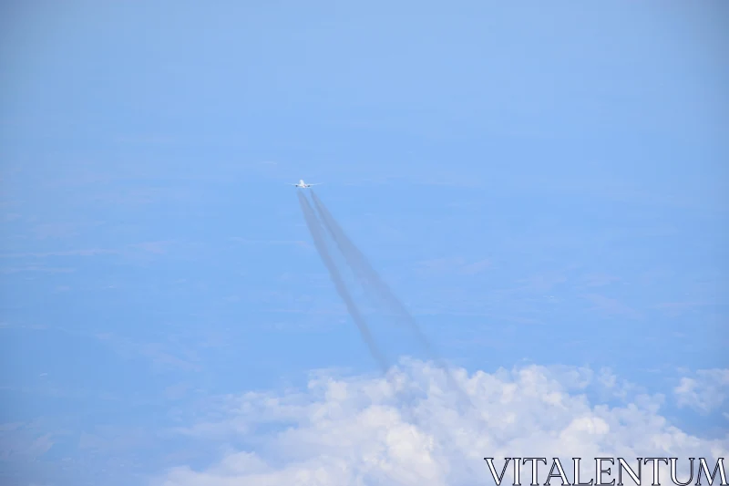 PHOTO Plane in the Sky with Smoke