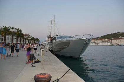 Promenade with Yacht in Coastal Urban Setting