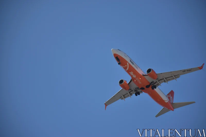 PHOTO Airplane Flying in Blue Sky