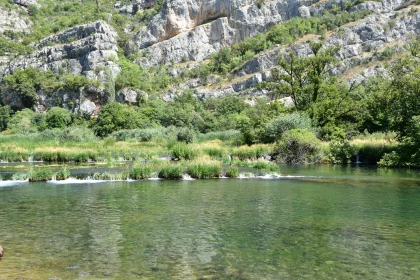 Tranquil River Scene with Cliffs