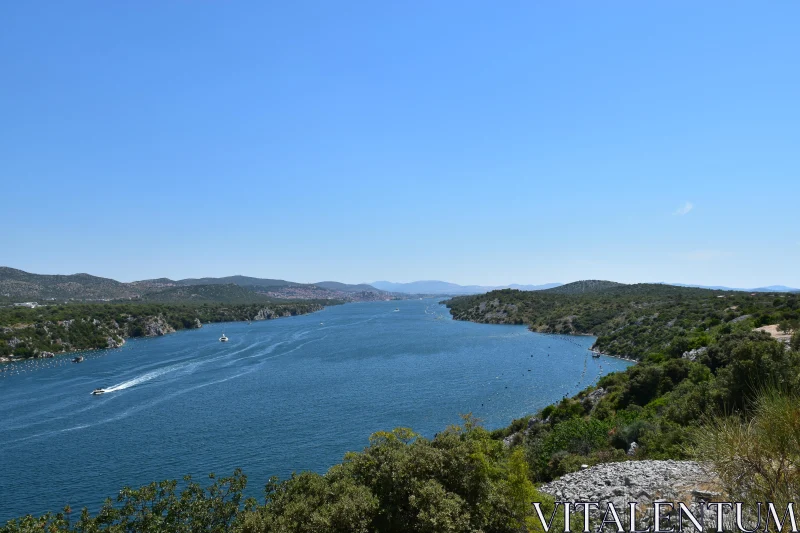 PHOTO Scenic View of River with Boats