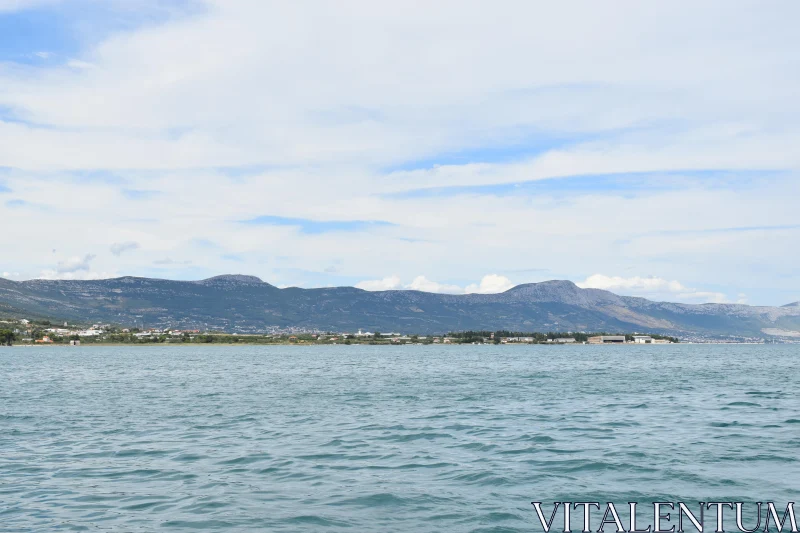 Coastal Mountains and Calm Waters Free Stock Photo