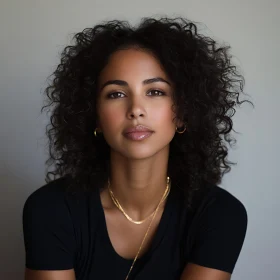 Curly-Haired Woman with Gold Earrings and Necklaces