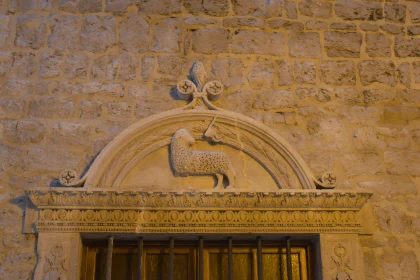 Historic Lamb and Cross Relief in Stone