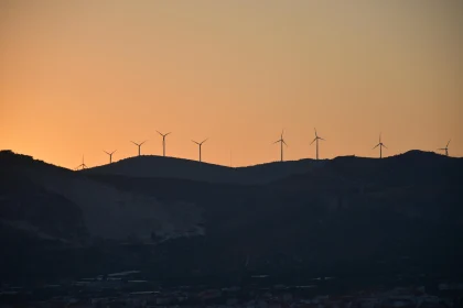 Silhouetted Windmills at Sunset