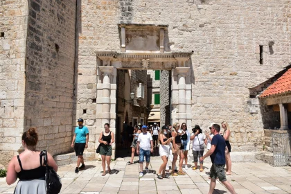 Historic Gate with Tourists in City