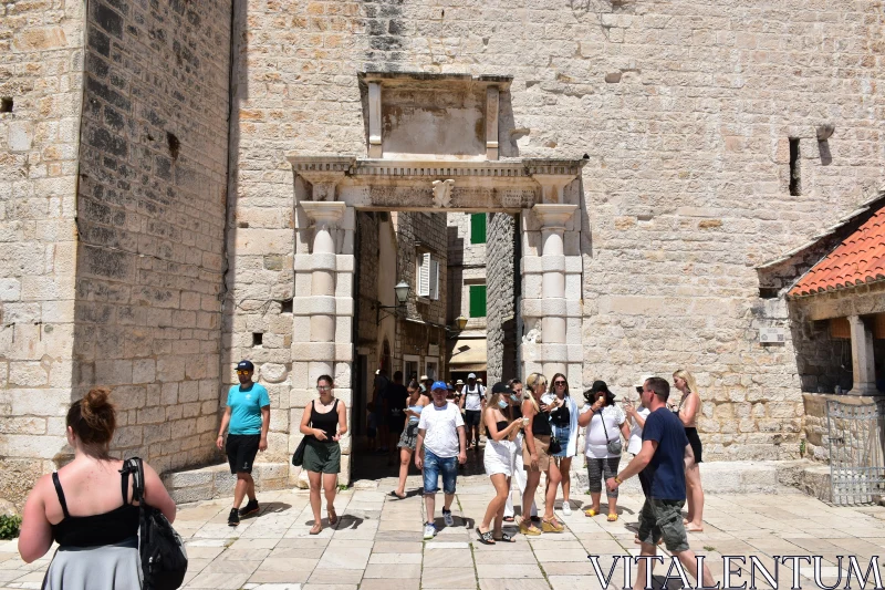 Historic Gate with Tourists in City Free Stock Photo