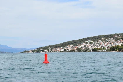 Tranquil Seaside View with Floating Red Buoy