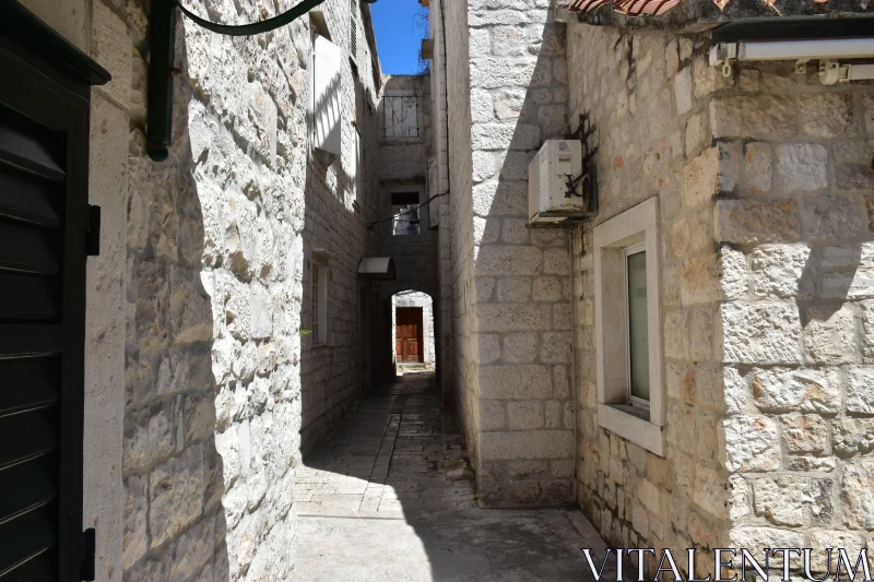 Sunlit Stone Alley Free Stock Photo