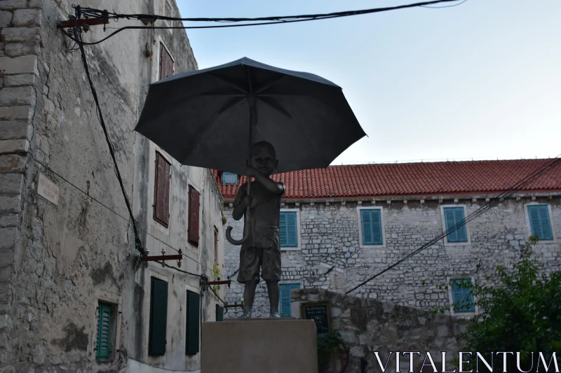 PHOTO Child Holding Umbrella Sculpture