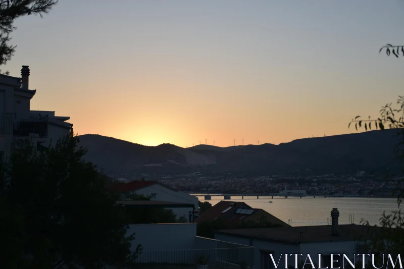 PHOTO Sunset Glow Over Hills and Town