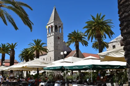 Trogir's Iconic Bell Tower and Lively Cafe Scene