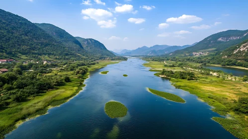Serene River Flowing Between Verdant Mountains