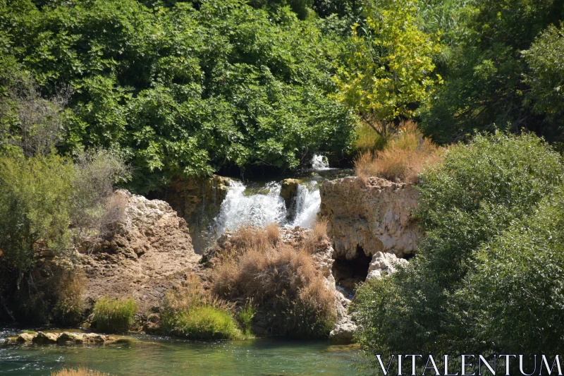 Tranquil Cascade Amidst Nature Free Stock Photo