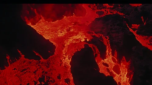 Fiery Lava Stream Across Dark Rocks