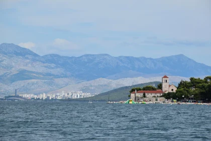 Historic Waterfront Church with Scenic Mountains