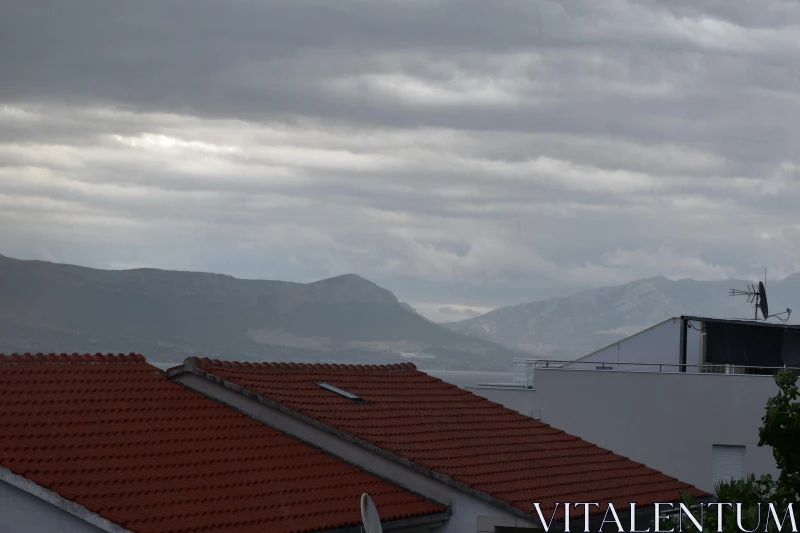 Overcast Mountains and Rooftops Free Stock Photo