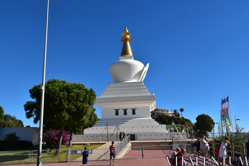 Buddhist Stupa with Lush Surroundings Free Stock Photo