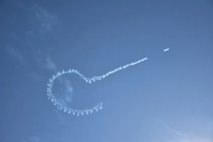 Looping Smoke Patterns in Clear Sky