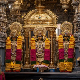 Majestic Golden Deities in Ornate Hindu Temple