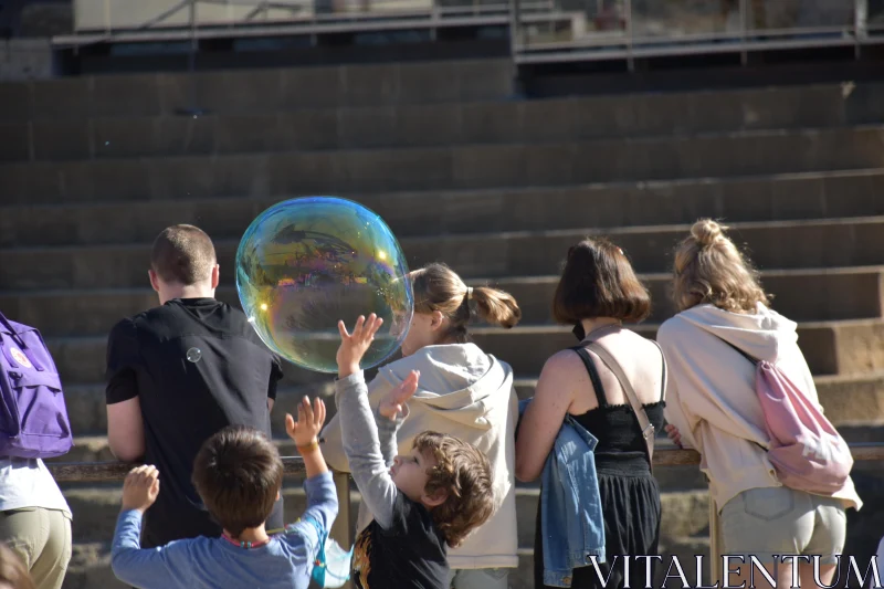 Urban Kids Enjoying a Soap Bubble Free Stock Photo